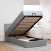 Cama otomana con colchón y LED tela gris claro 90x200 cm