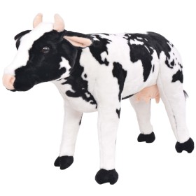 Vaca de peluche de pie negra y blanca