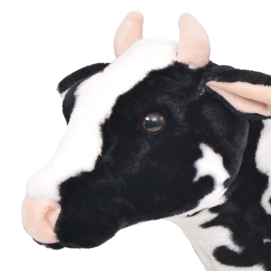Vaca de peluche de pie negra y blanca