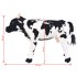 Vaca de peluche de pie negra y blanca