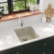 Fregadero de cocina de granito con un seno beige