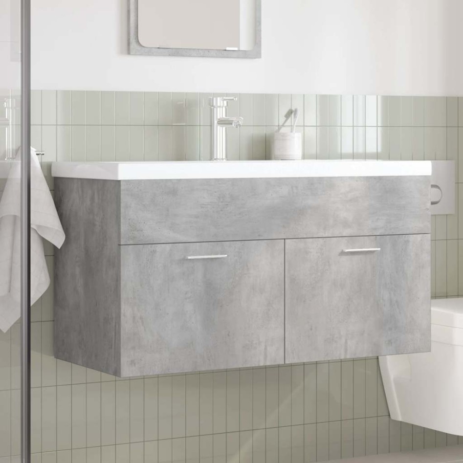 Mueble de baño con lavabo incorporado y grifo gris
