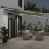 Toldo retráctil manual luz LED antracita y blanco 600x350