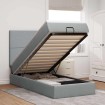 Cama otomana con colchón y LED tela gris claro 90x200 cm