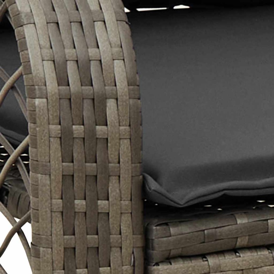 Silla mecedora de jardín con cojines ratán sintético