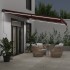 Toldo retráctil manual con LEDs burdeos 500x350