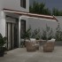 Toldo retráctil manual con luz LED marrón 450x300