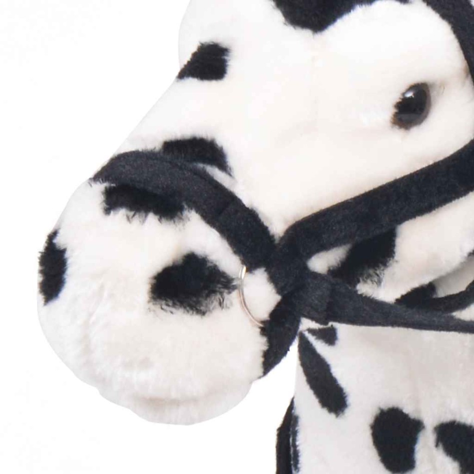 Caballo de peluche de pie negro y blanco
