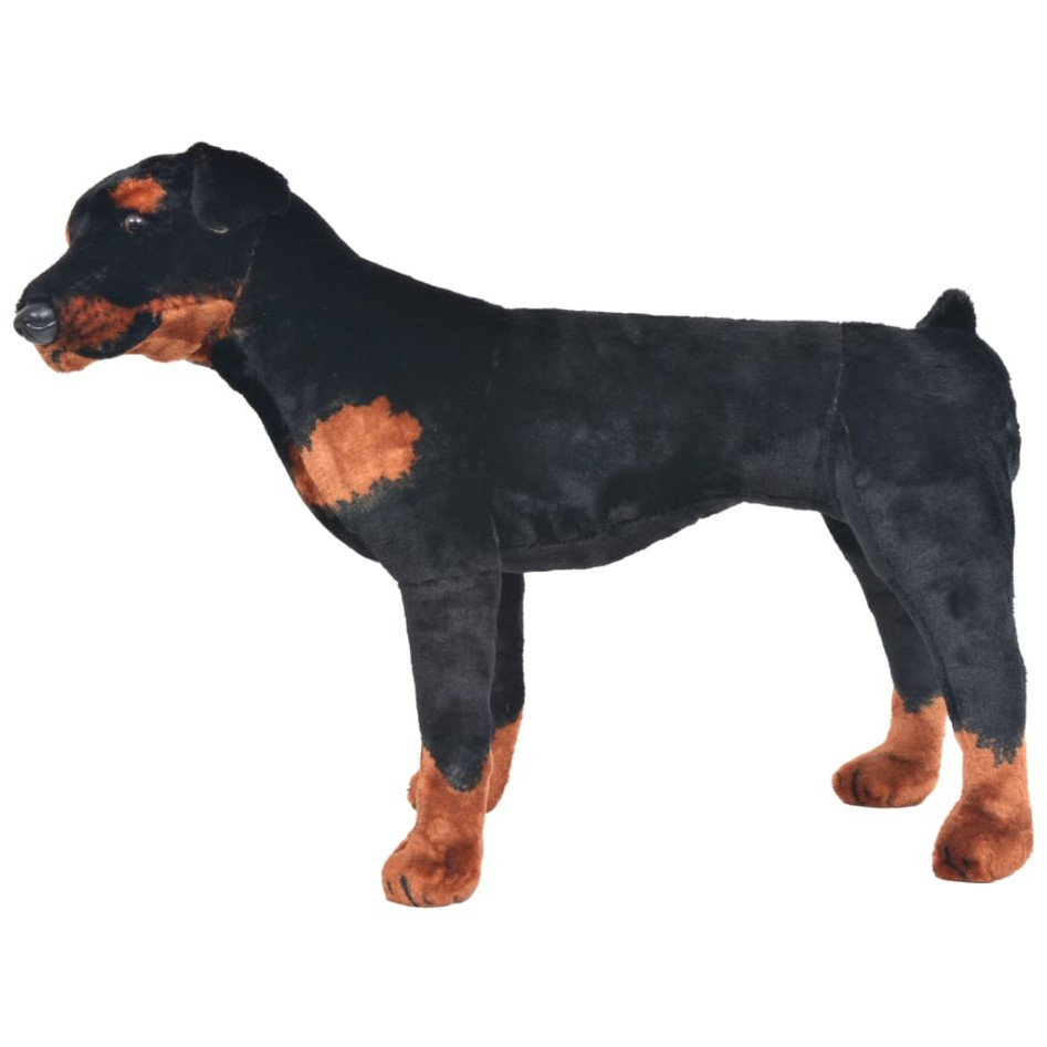 Perro rottweiler de peluche de pie negro y marrón
