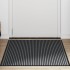 Felpudo a rayas negro y gris 90x150