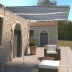 Toldo retráctil manual con LED azul y blanco 350x250 cm