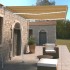 Toldo retráctil manual con LED amarillo y blanco 350x250